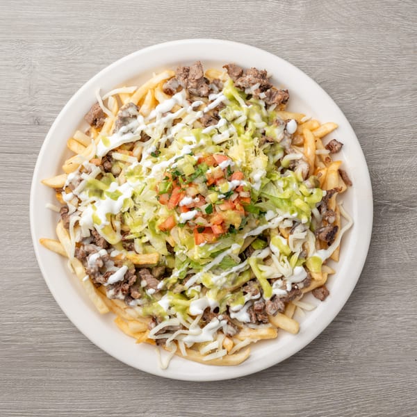 Carne asada fries topped with shredded cheese, sour cream, guacamole, and pico de gallo.